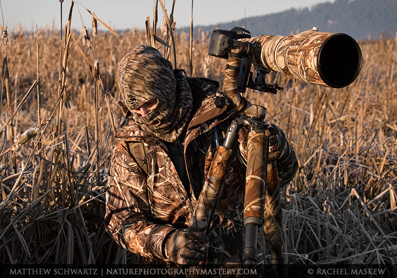 Matthew Schwartz in a marsh with full camo